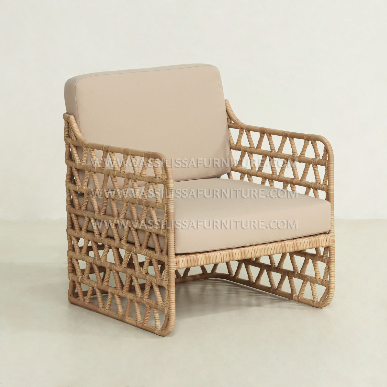 Japandi-style indoor rattan armchair with teak wood frame and beige cushions